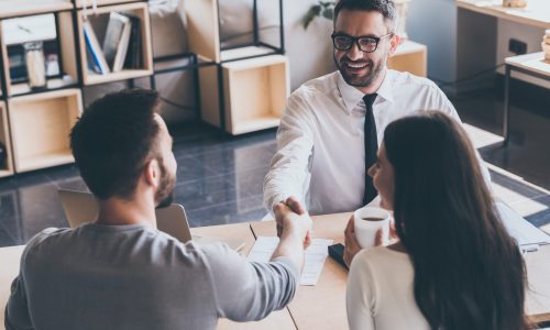 Sealing,A,Deal.,Top,View,Of,Two,Men,Sitting,At